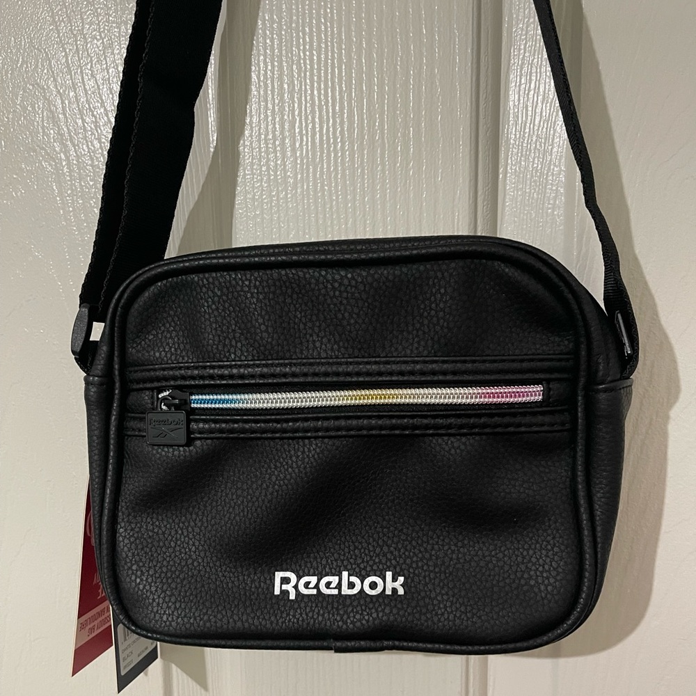 - Brand new Reebok crossbody bag with adjustable strap